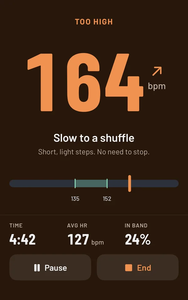 Run screen showing 164 bpm, too high, telling you to ease off